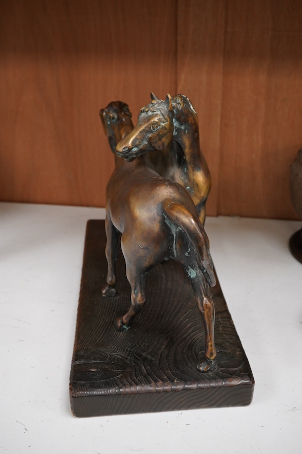 A Romanian bronze of two horses, 45cm wide